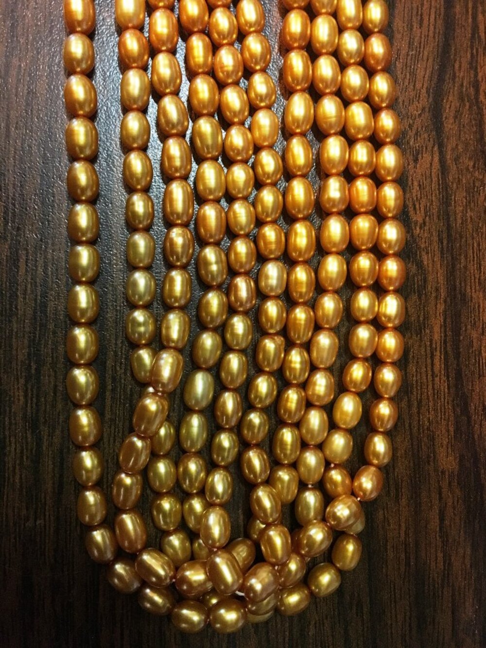 Five (5) 16" Strands 5mmx7mm GOLD FRESHWATER PEARLS - great color, oval shape